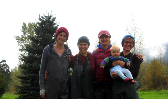 The 2015 Rootdown Farm crew, happy if a bit tired, sporting our work rain gear.